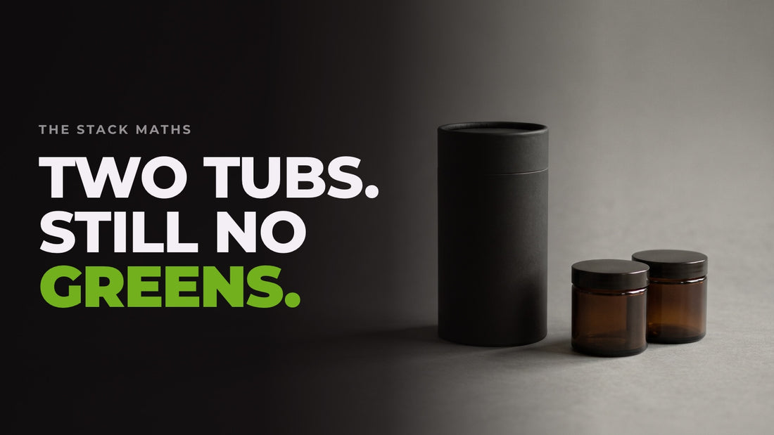 One tall unlabelled tub beside two smaller jars on a dark studio backdrop. Headline: Two tubs. Still no greens.