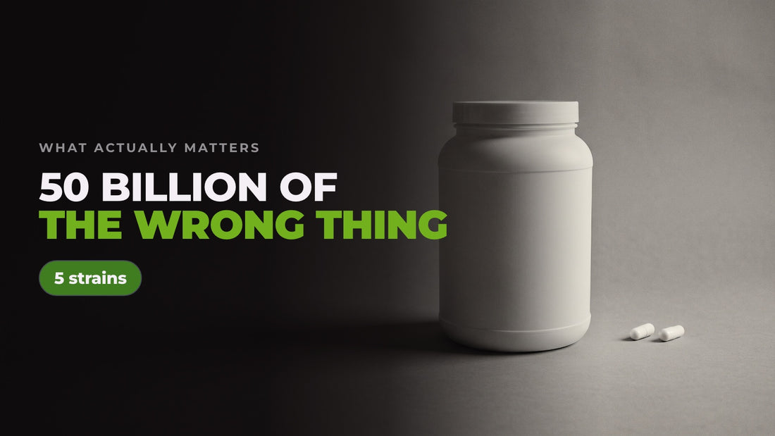 An oversized white supplement tub dwarfing two small capsules on a grey backdrop, captioned “50 billion of the wrong thing” alongside a note reading 5 strains.