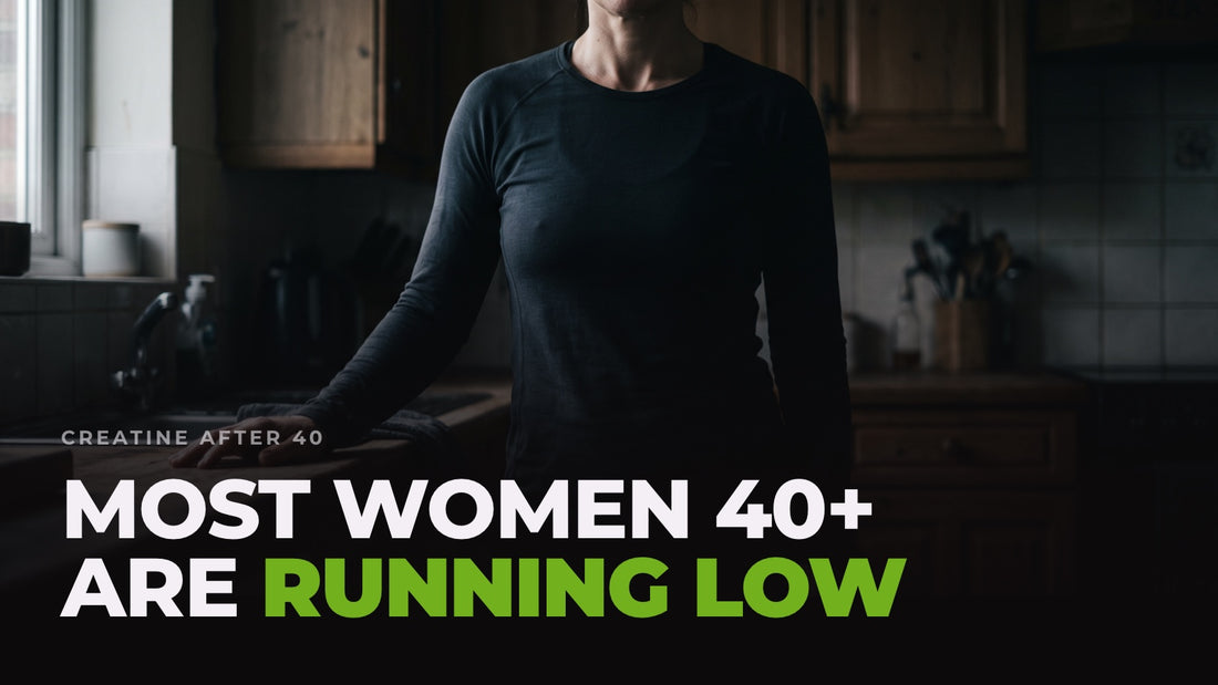 A woman in her forties in a dim kitchen, cropped below the face, one hand resting on the worktop, captioned “Most women 40+ are running low”.