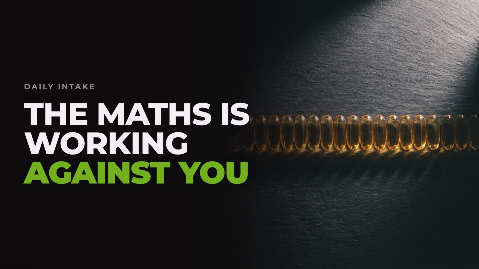 A long row of amber omega-3 softgel capsules on black slate under raking light, captioned “The maths is working against you”.