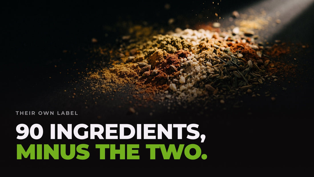 A drift of dozens of different coloured powders and seeds mixed together under a hard light. Headline: 90 ingredients, minus the two.
