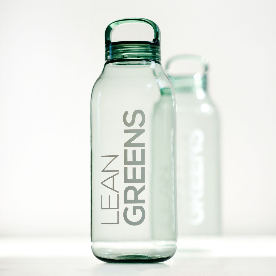 A clear green Kinto water bottle with a loop lid, printed with the Lean Greens wordmark.